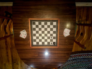 Glimpse into the interior of the Checkmate Room. Wonder what that chess board is for?